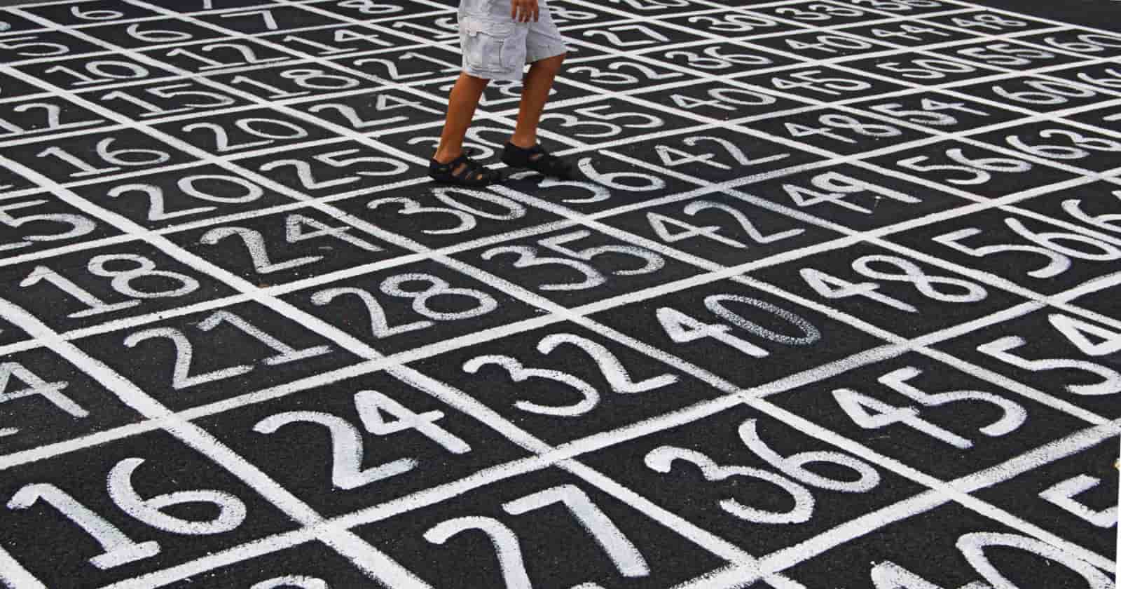 Man walking over lottery numbers